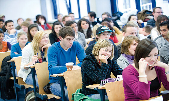 students sitting in a classroom of the university 