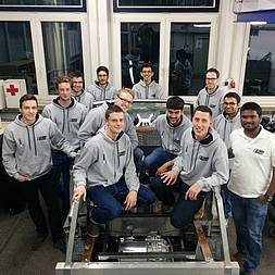 All members of the LUNA project, sitting in a laboratory. 