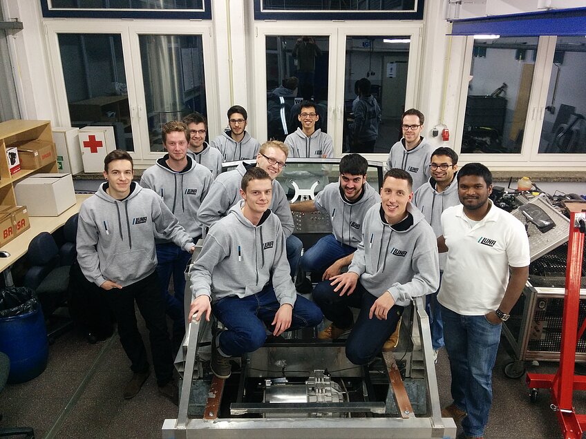 All members of the LUNA project, sitting in a laboratory. 