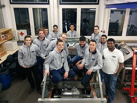 All members of the LUNA project, sitting in a laboratory. 